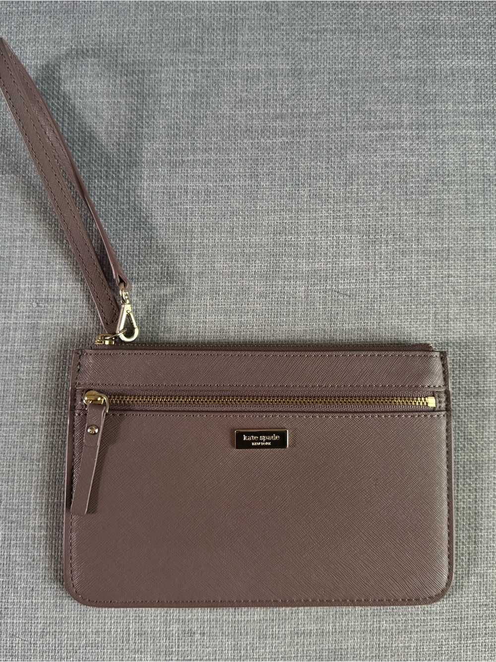 kate spade mauve taupe leather wristlet with gold-tone hardware